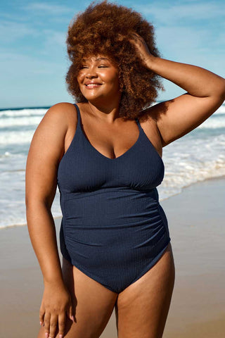 Model wears a XL. She is a size 16, wears a 16E bra and is 180cm tall.